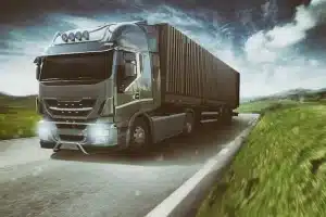 grey truck moving fast road natural landscape with cloudy sky 207634 1260 1
